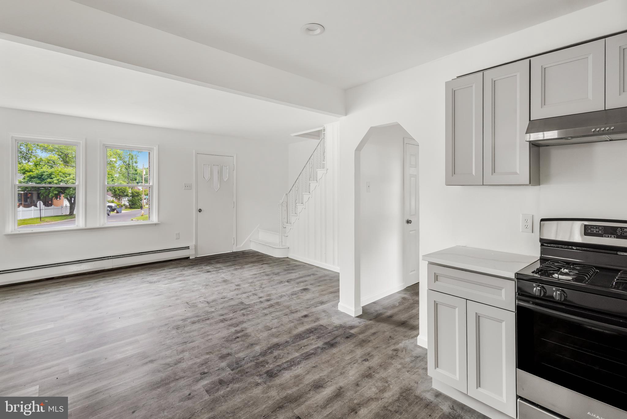 505 West Evesham Road, Unit A Glendora, NJ 08029 - Photo 5 of 11 a kitchen with granite countertop a stove and a refrigerator