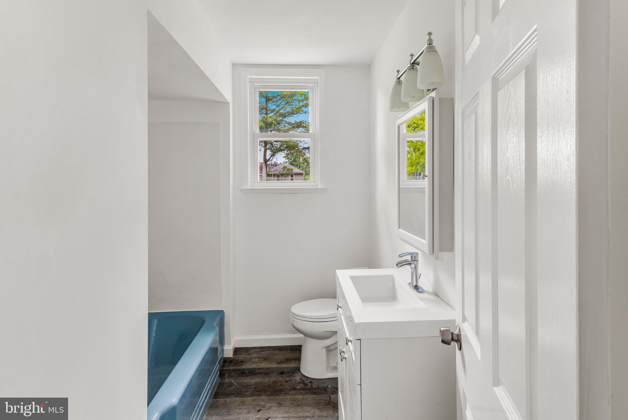 505 West Evesham Road, Unit A Glendora, NJ 08029 - Photo 7 of 11 a bathroom with a sink a toilet and shower