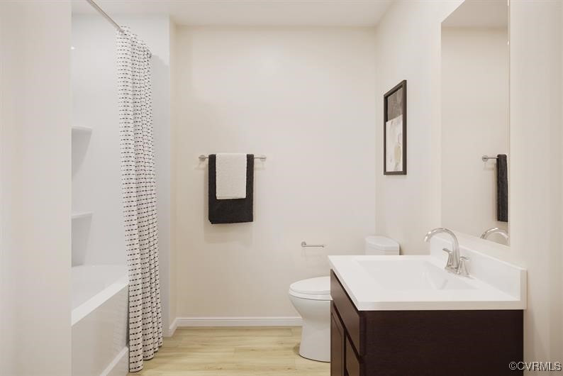 539 Destination Way, Unit A Sandston, VA 23150 - Photo 8 of 9 a bathroom with a sink a toilet a mirror and shower