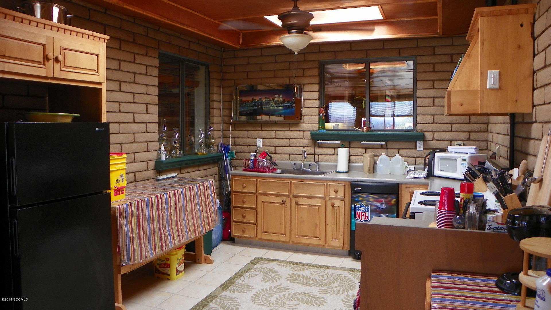 1623 Bufeo Court Rio Rico, AZ 85648 - Photo 37 of 52 a kitchen with granite countertop lots of clutter and stainless steel appliances