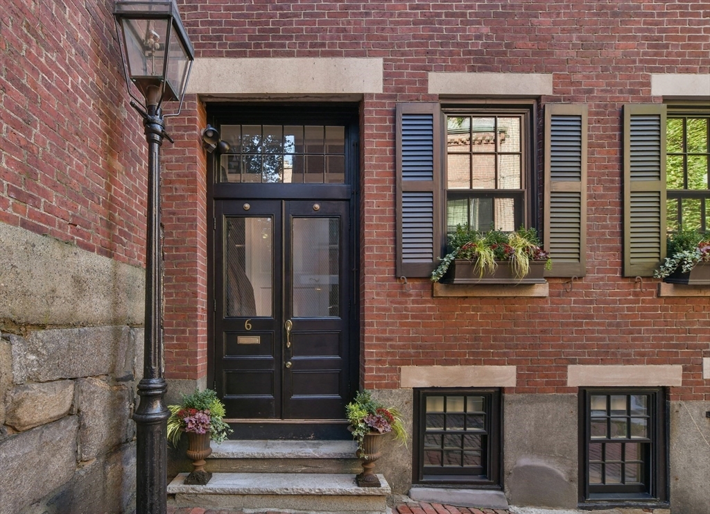 a front view of a house with a glass windows