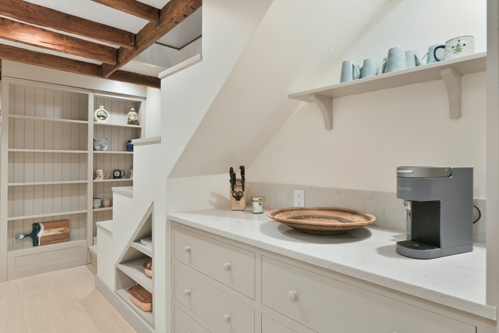 6 Strong Place Boston, MA 02114 - Photo 11 of 25 a kitchen with a sink and a stove