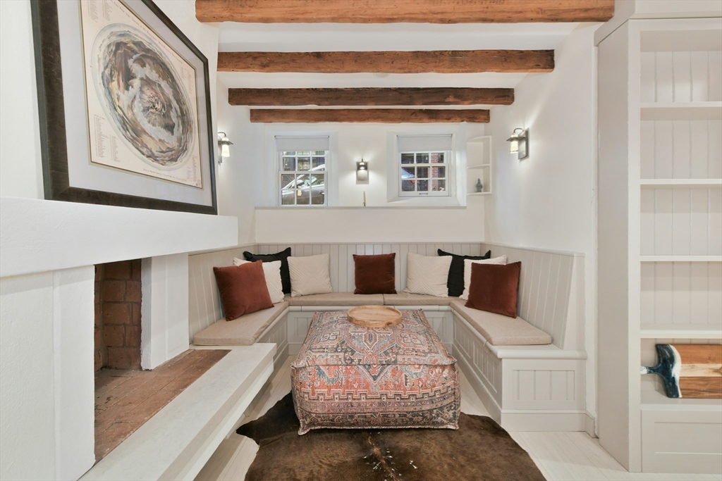 6 Strong Place Boston, MA 02114 - Photo 13 of 25 a living room with furniture and a painting on the wall