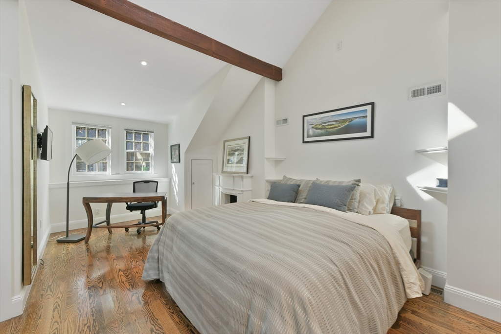 6 Strong Place Boston, MA 02114 - Photo 15 of 25 a bedroom with a bed and a table