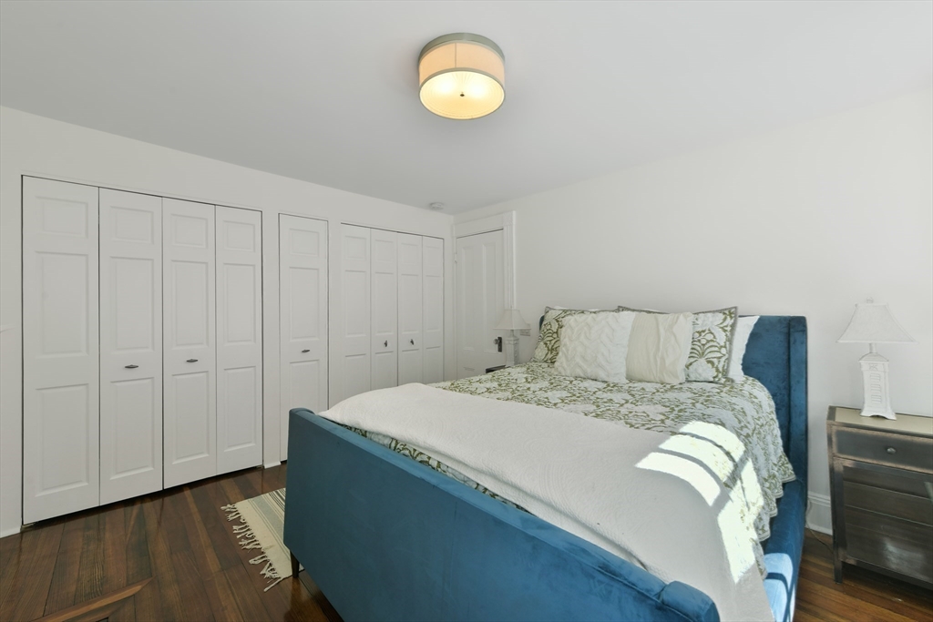 6 Strong Place Boston, MA 02114 - Photo 21 of 25 a bedroom with a bed and a window