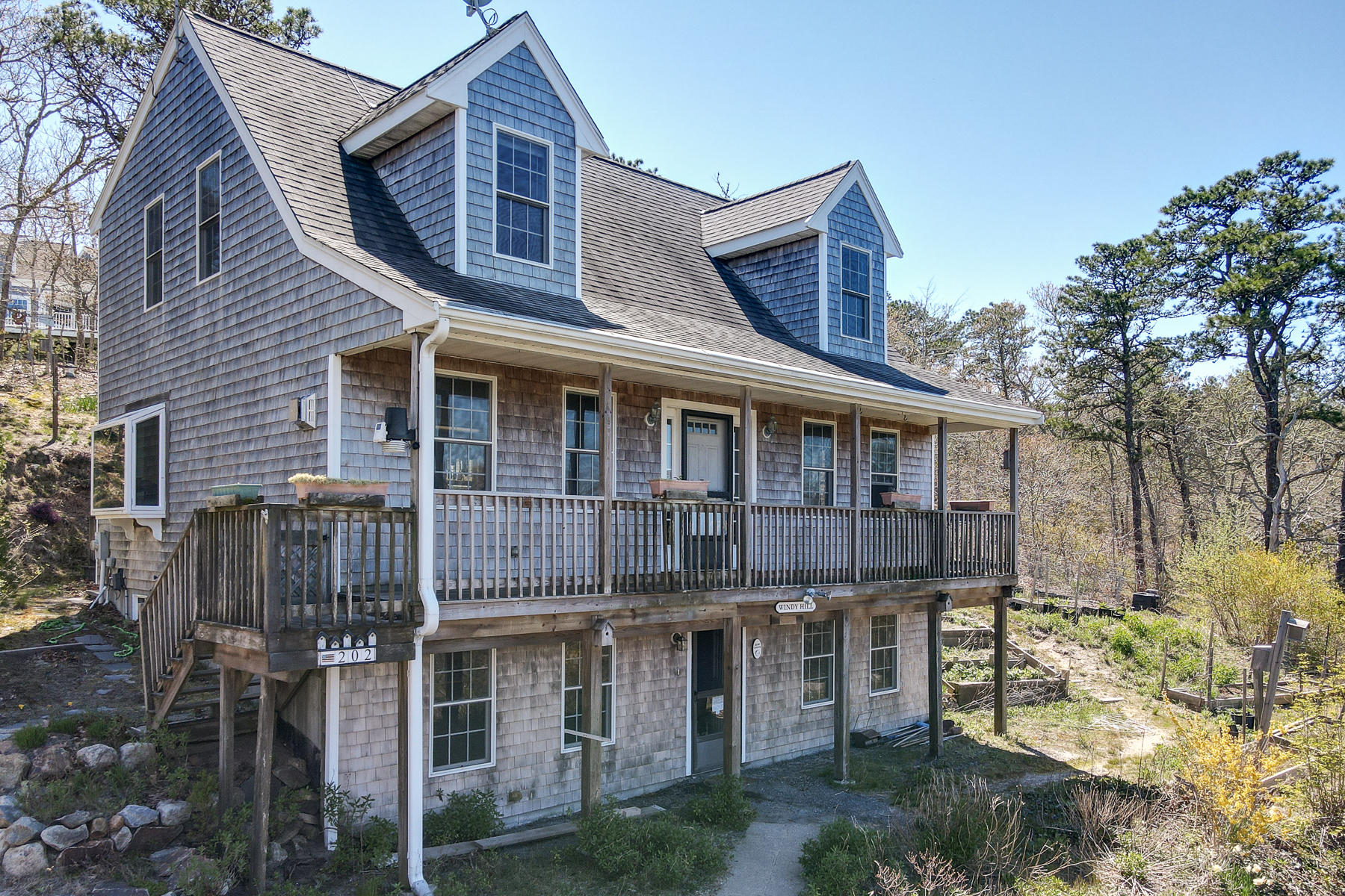 202 Northgate Road North Chatham, MA 02633 - Photo 1 of 34 a front view of a house with a yard