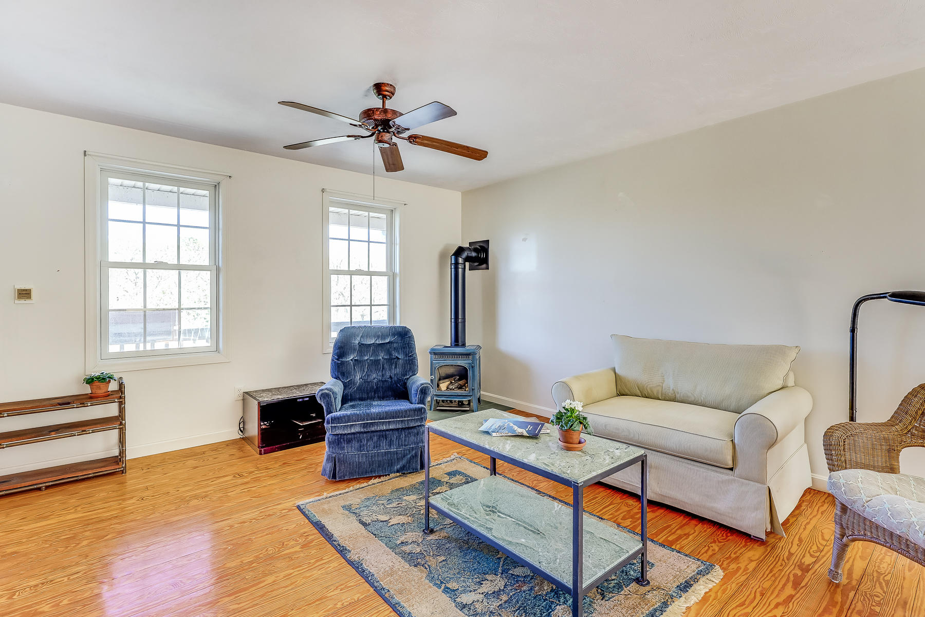 202 Northgate Road North Chatham, MA 02633 - Photo 16 of 34 a living room with furniture ceiling fan and a window