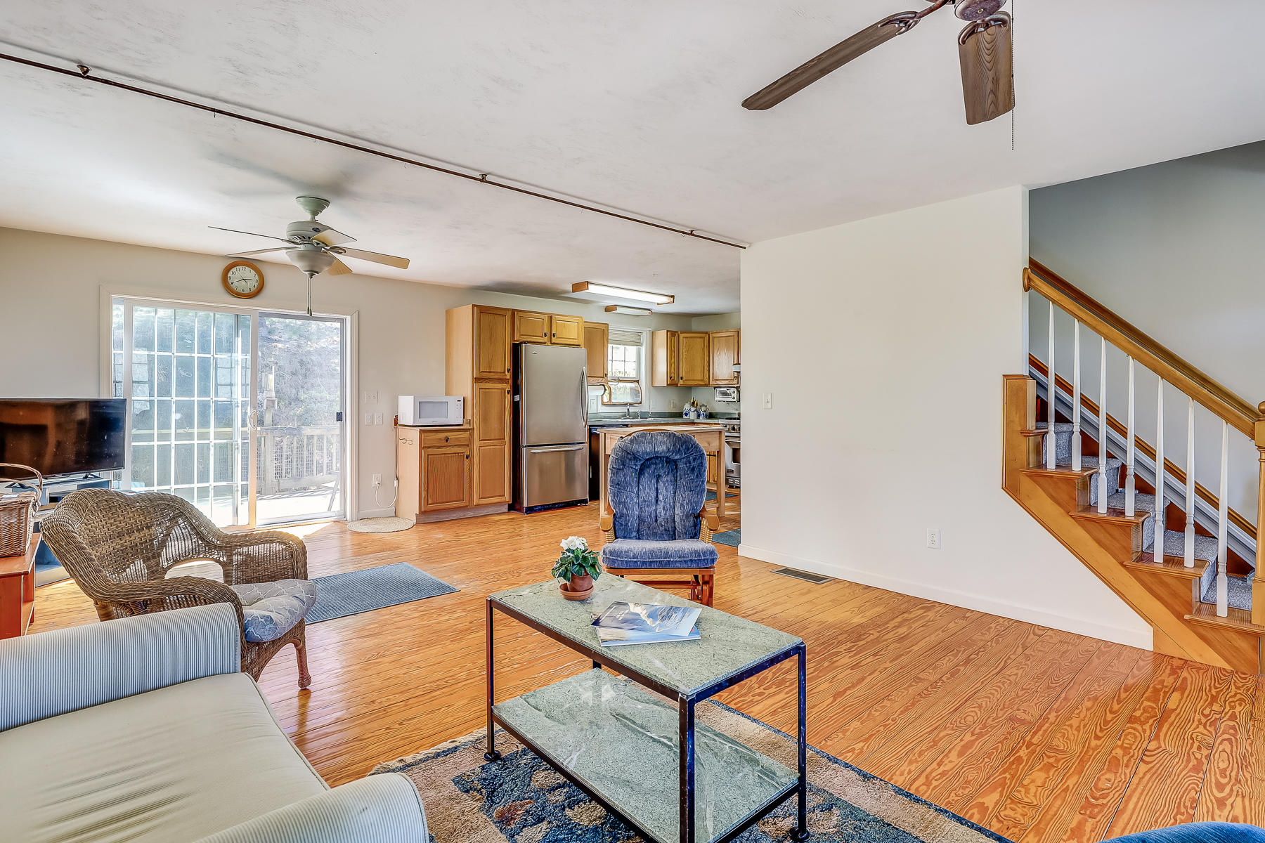 202 Northgate Road North Chatham, MA 02633 - Photo 17 of 34 a living room with furniture a flat screen tv and a table