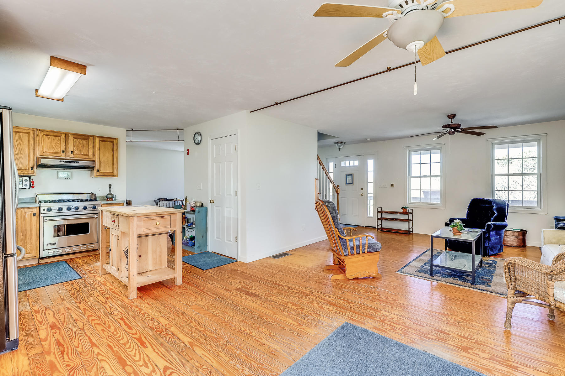 202 Northgate Road North Chatham, MA 02633 - Photo 19 of 34 a kitchen with a stove a refrigerator and a dining table with wooden floor