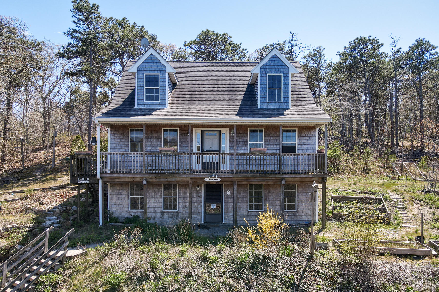 202 Northgate Road North Chatham, MA 02633 - Photo 2 of 34 a front view of a house with garden