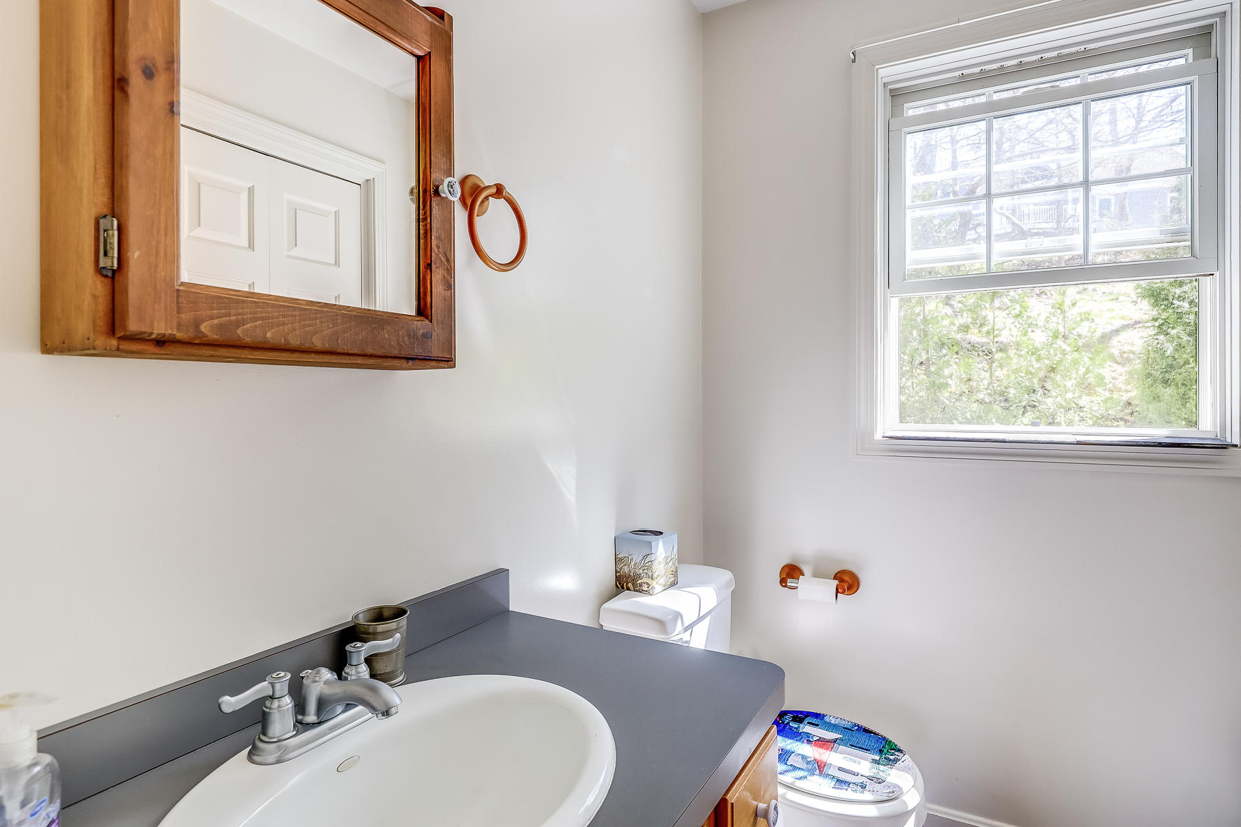 202 Northgate Road North Chatham, MA 02633 - Photo 24 of 34 a bathroom with a sink and a mirror