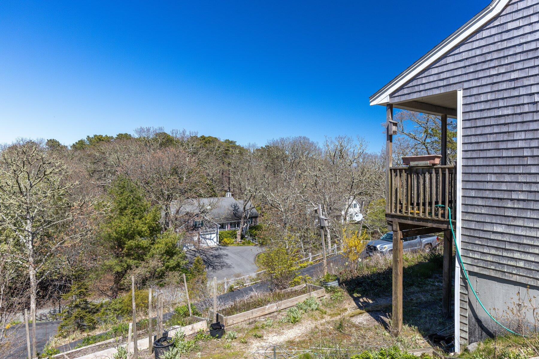 202 Northgate Road North Chatham, MA 02633 - Photo 9 of 34 a view of a house with a yard and balcony