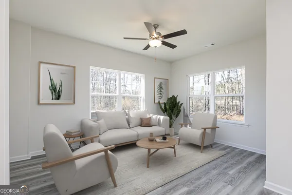 a living room with furniture and a large window