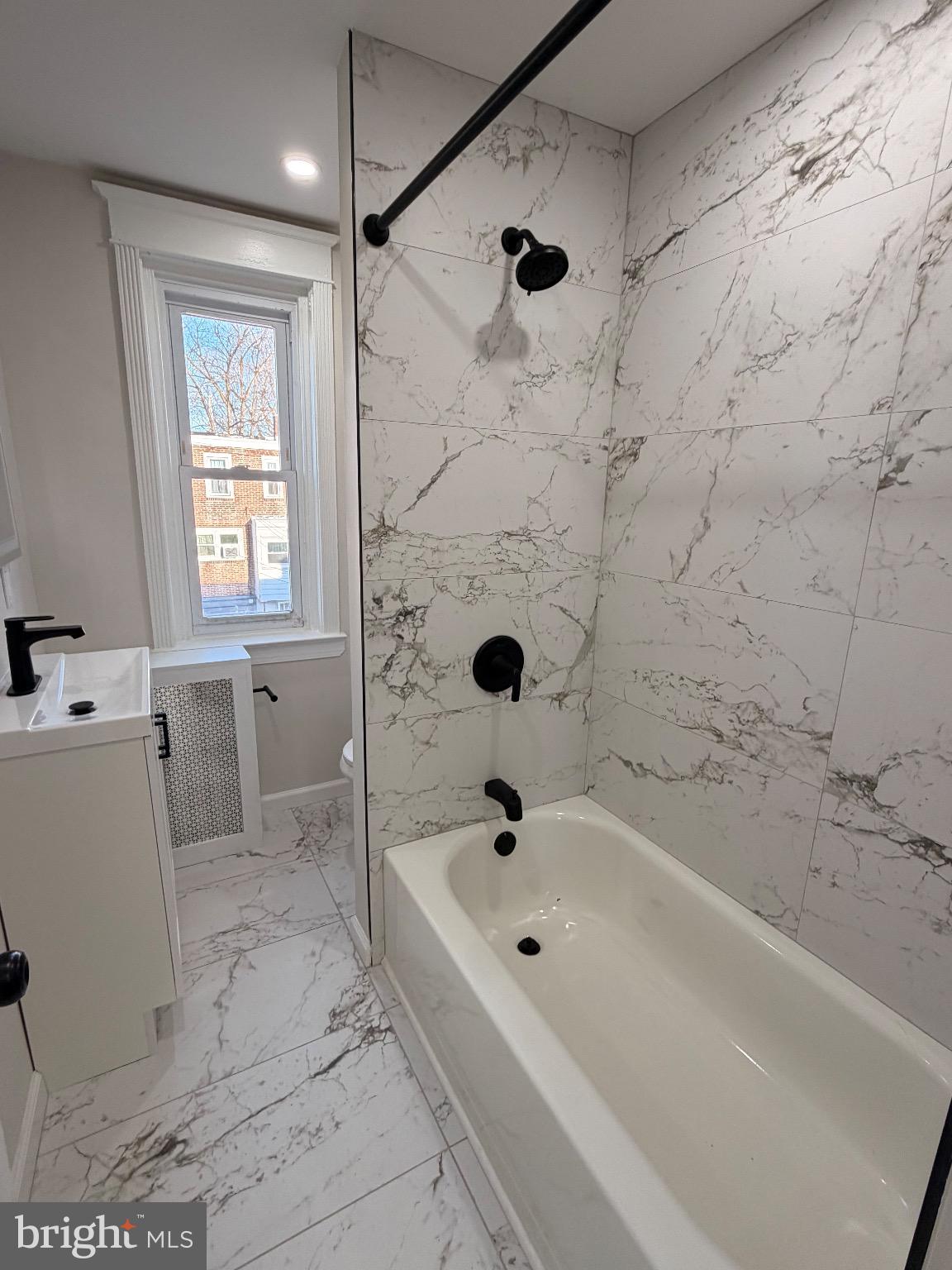 641 Copley Road Upper Darby, PA 19082 - Photo 17 of 29 Elegant marble bath with modern fixtures.