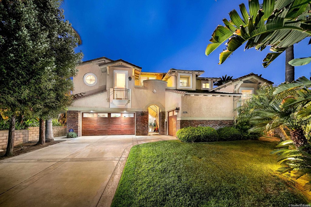 6425 Topmast Drive Carlsbad, CA 92011 - Photo 1 of 32 a front view of a house with a yard