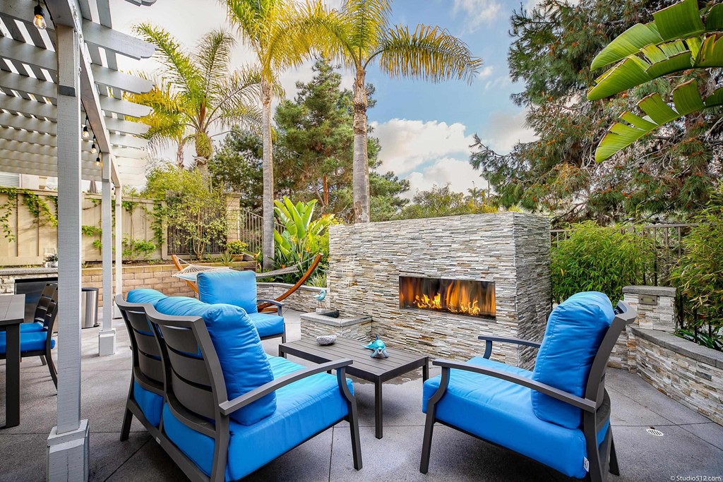 6425 Topmast Drive Carlsbad, CA 92011 - Photo 24 of 32 a view of an outdoor sitting area with furniture and wooden floor