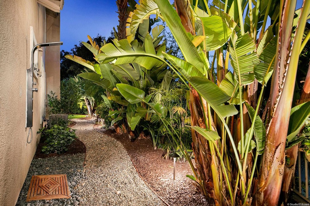 6425 Topmast Drive Carlsbad, CA 92011 - Photo 29 of 32 a view of a yard with plants and wooden fence
