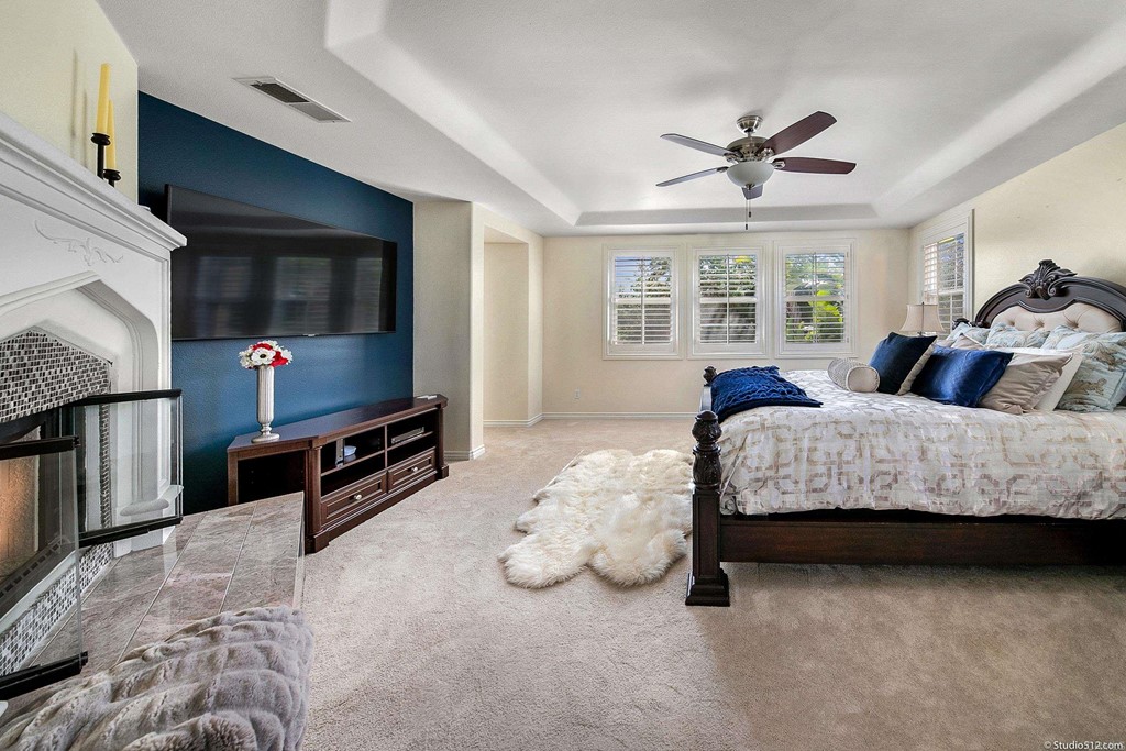 6425 Topmast Drive Carlsbad, CA 92011 - Photo 5 of 32 a bedroom with bed and a flat tv screen