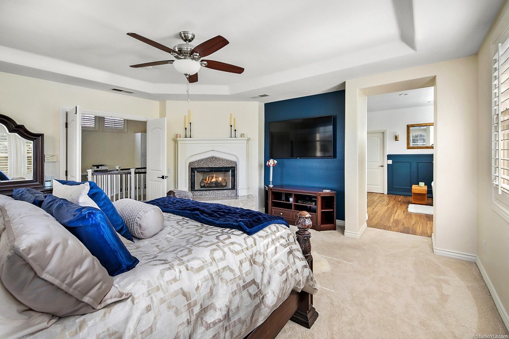 6425 Topmast Drive Carlsbad, CA 92011 - Photo 6 of 32 a bed room with a bed and a fireplace