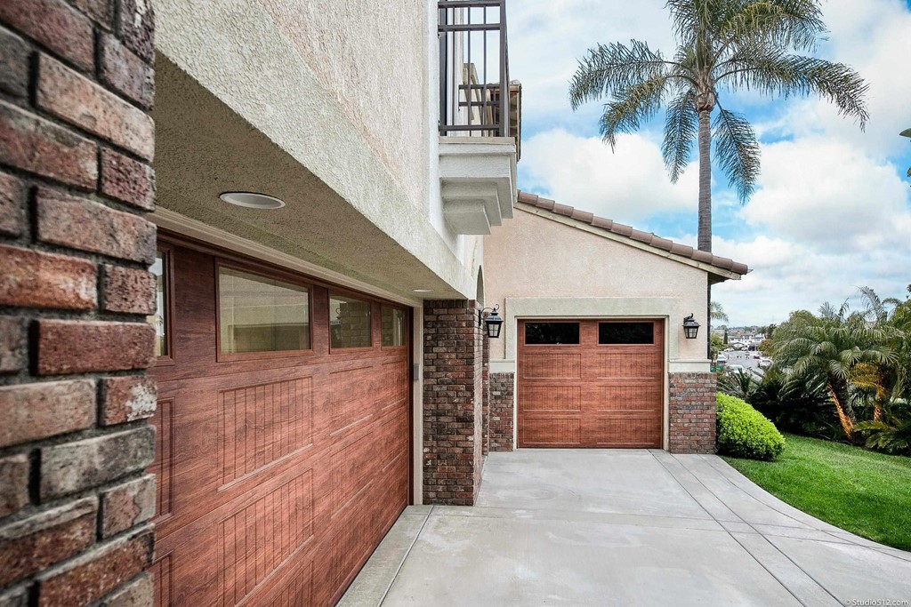 6425 Topmast Drive Carlsbad, CA 92011 - Photo 9 of 32 a front view of a house with a yard