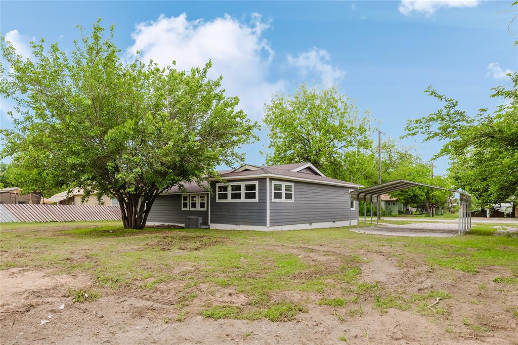 524 West Roberts Street Gorman, TX 76454 - Photo 32 of 35 a house that has a tree in front of it