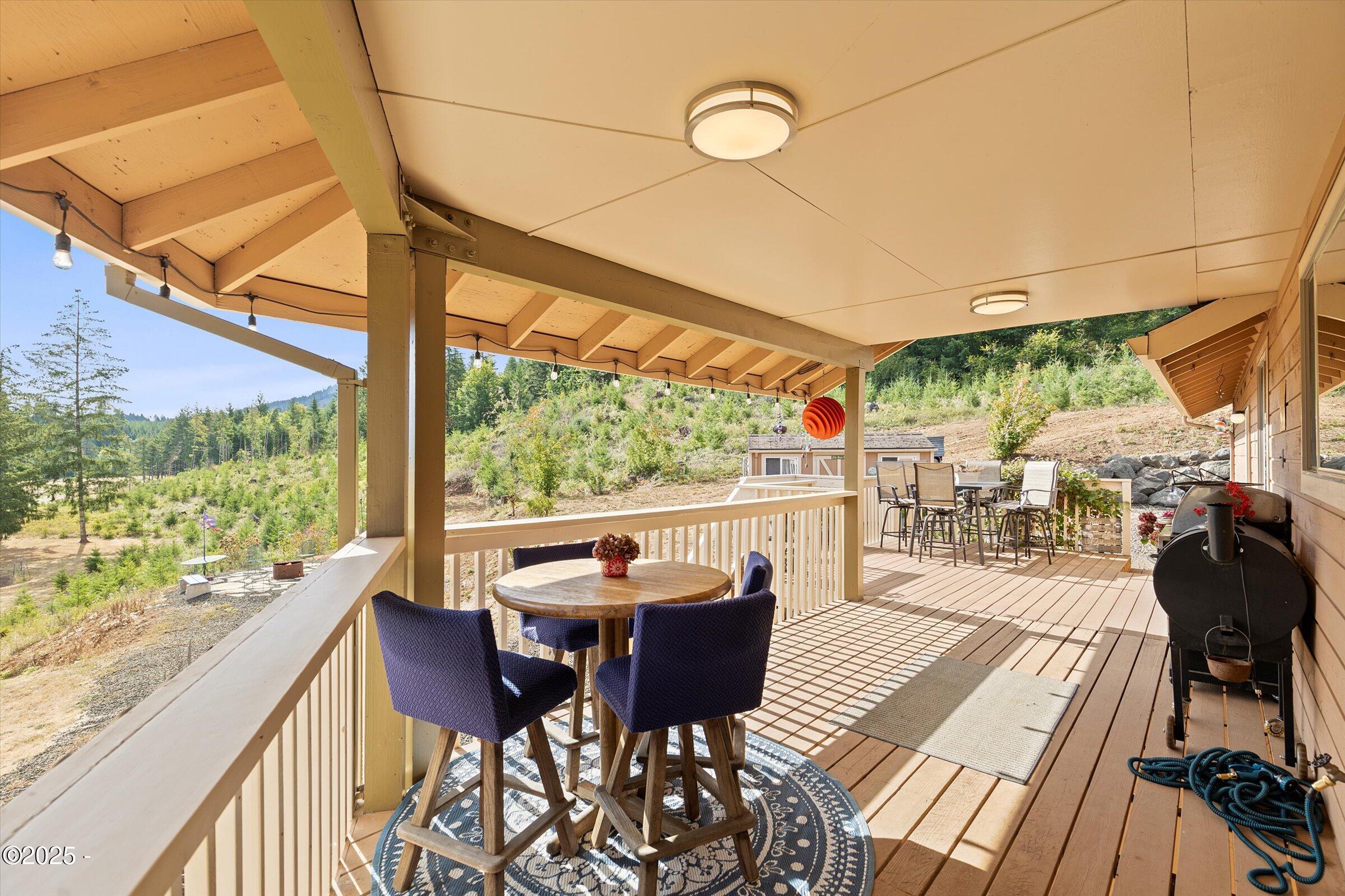 21560 Gooseneck Road Sheridan, OR 97378 - Photo 57 of 63 a view of a dining room with furniture window and outside view