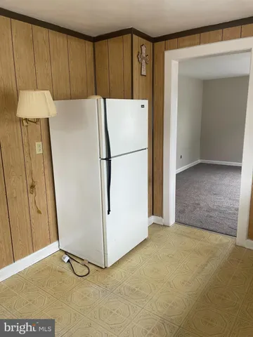 a view of a refrigerator in kitchen and a refrigerator
