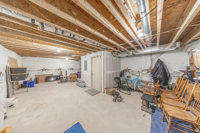 4765 Breezy Patch Road Eagle Mountain, UT 84005 - Photo 25 of 25 Unfinished basement space with exposed wooden joists and concrete flooring