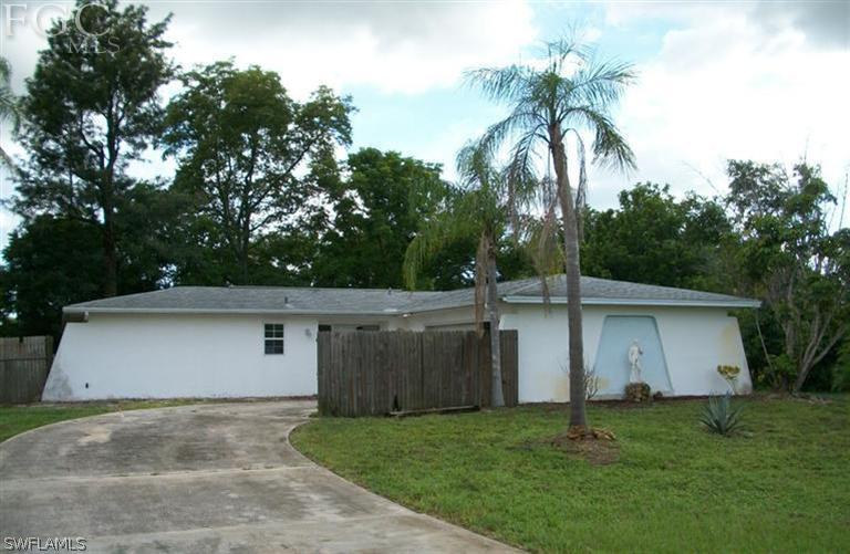 1802 Ridgecrest Street Lehigh Acres, FL 33936 - Photo 1 of 10 a view of a backyard of the house