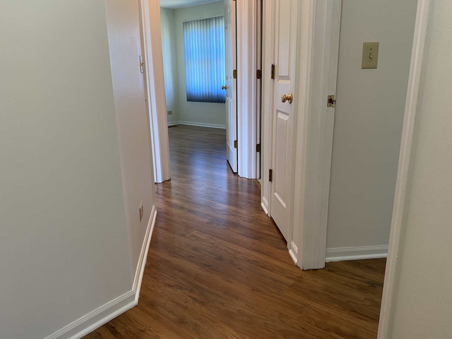 720 Daybreak Lane, Unit 720 Carol Stream, IL 60188 - Photo 13 of 22 a view of a hallway with wooden floor