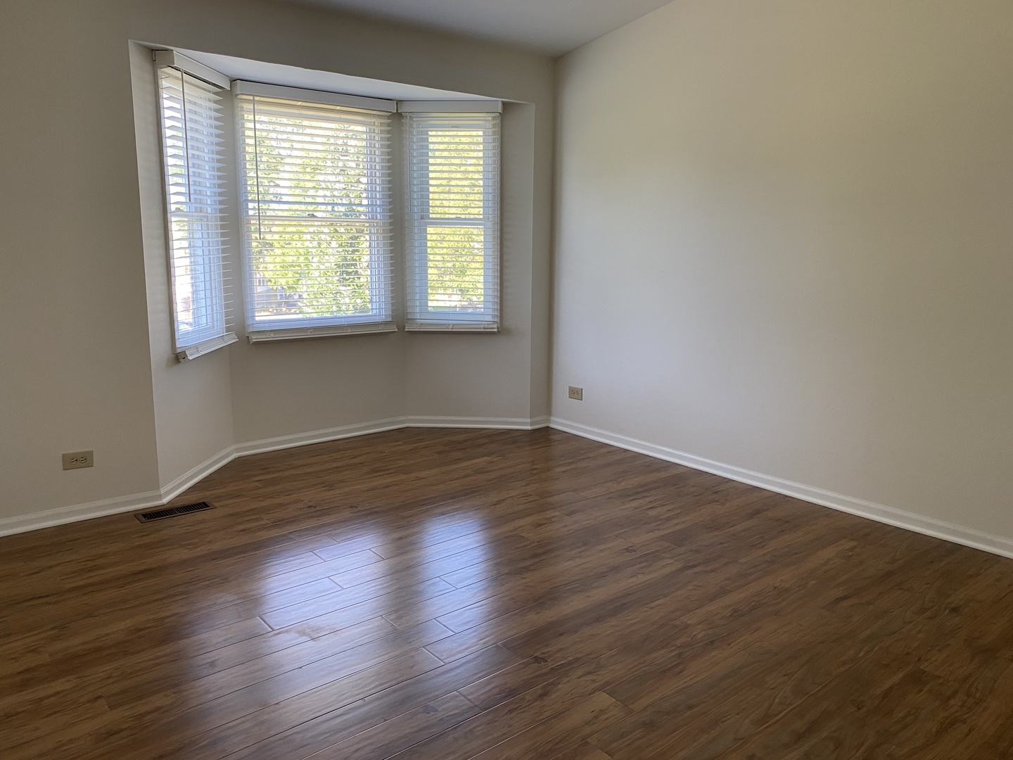 720 Daybreak Lane, Unit 720 Carol Stream, IL 60188 - Photo 14 of 22 a view of empty room with wooden floor and fan