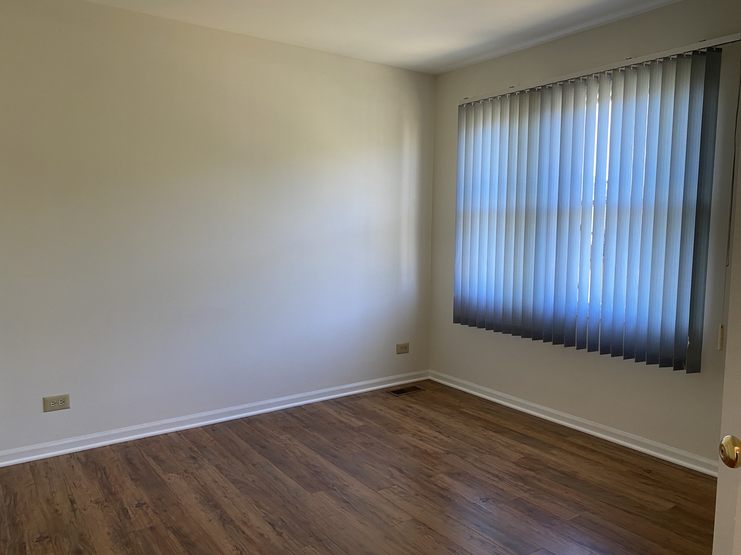 720 Daybreak Lane, Unit 720 Carol Stream, IL 60188 - Photo 19 of 22 an empty room with wooden floor and windows