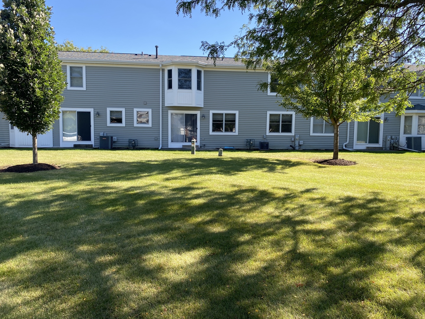 720 Daybreak Lane, Unit 720 Carol Stream, IL 60188 - Photo 22 of 22 a front view of a house with a yard