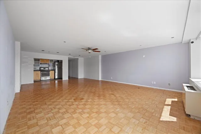 an empty room with a empty space and window