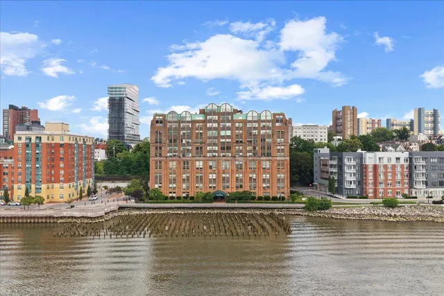 a view of water with a tall building