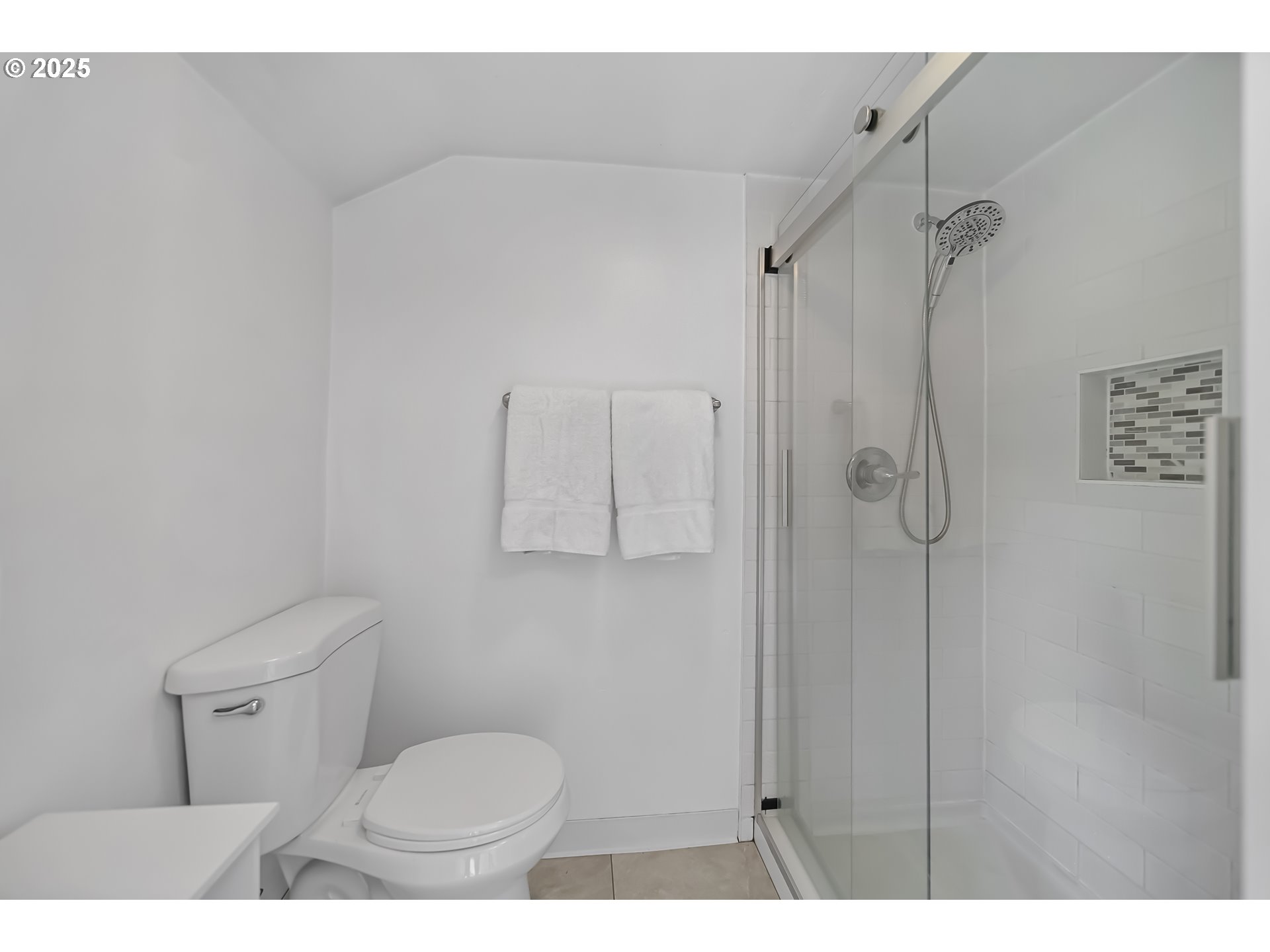 6026 Northeast 57th Avenue Portland, OR 97218 - Photo 20 of 45 a bathroom with a toilet and a shower