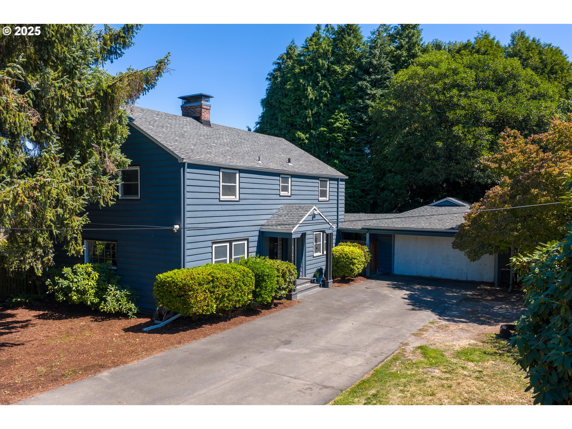 6026 Northeast 57th Avenue Portland, OR 97218 - Photo 2 of 45 a view of a house with a backyard