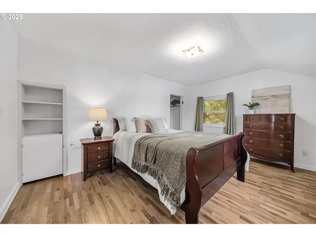 a bedroom with a bed and a dresser