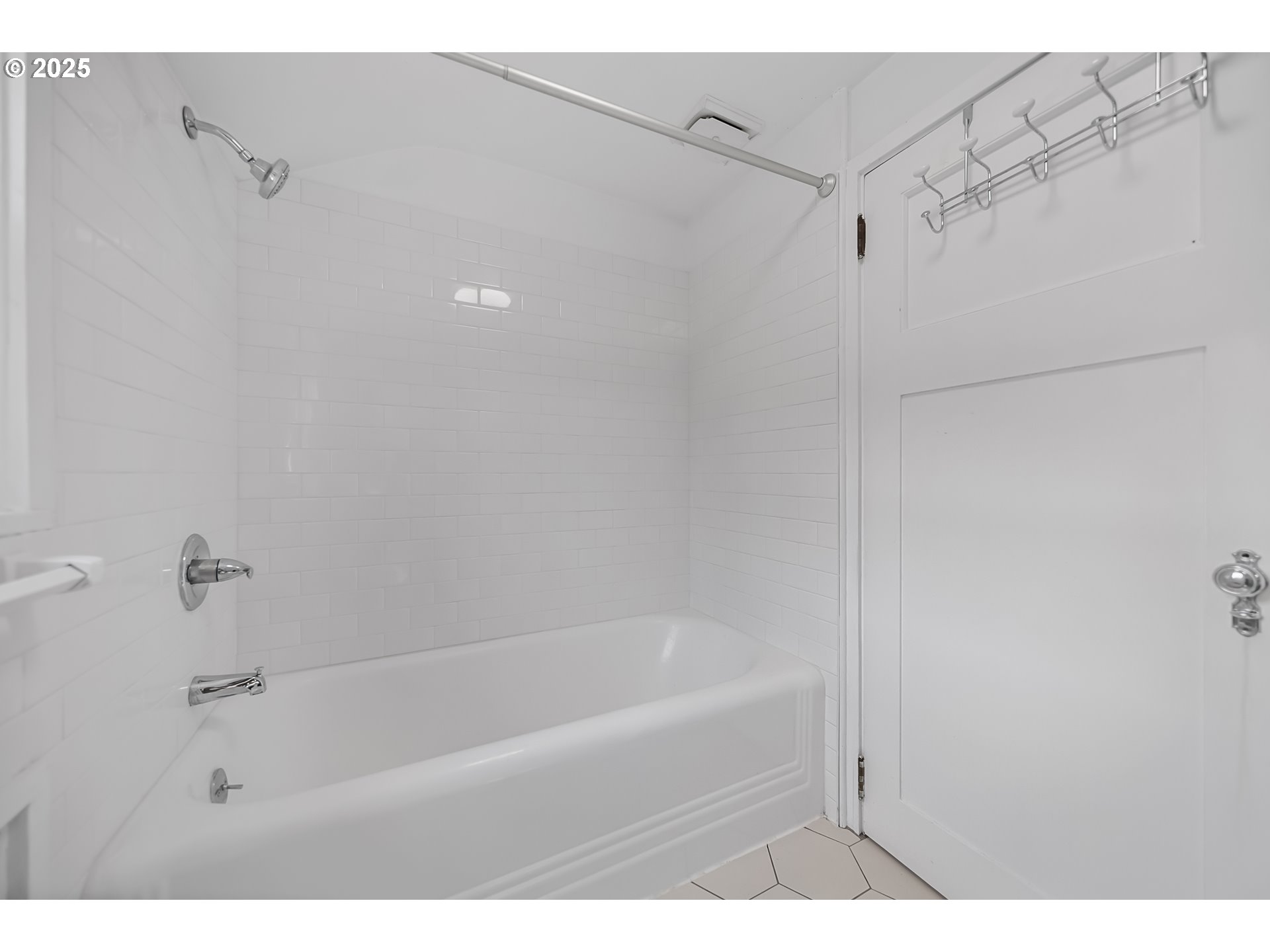 6026 Northeast 57th Avenue Portland, OR 97218 - Photo 26 of 45 a bathroom with a bathtub and a shower