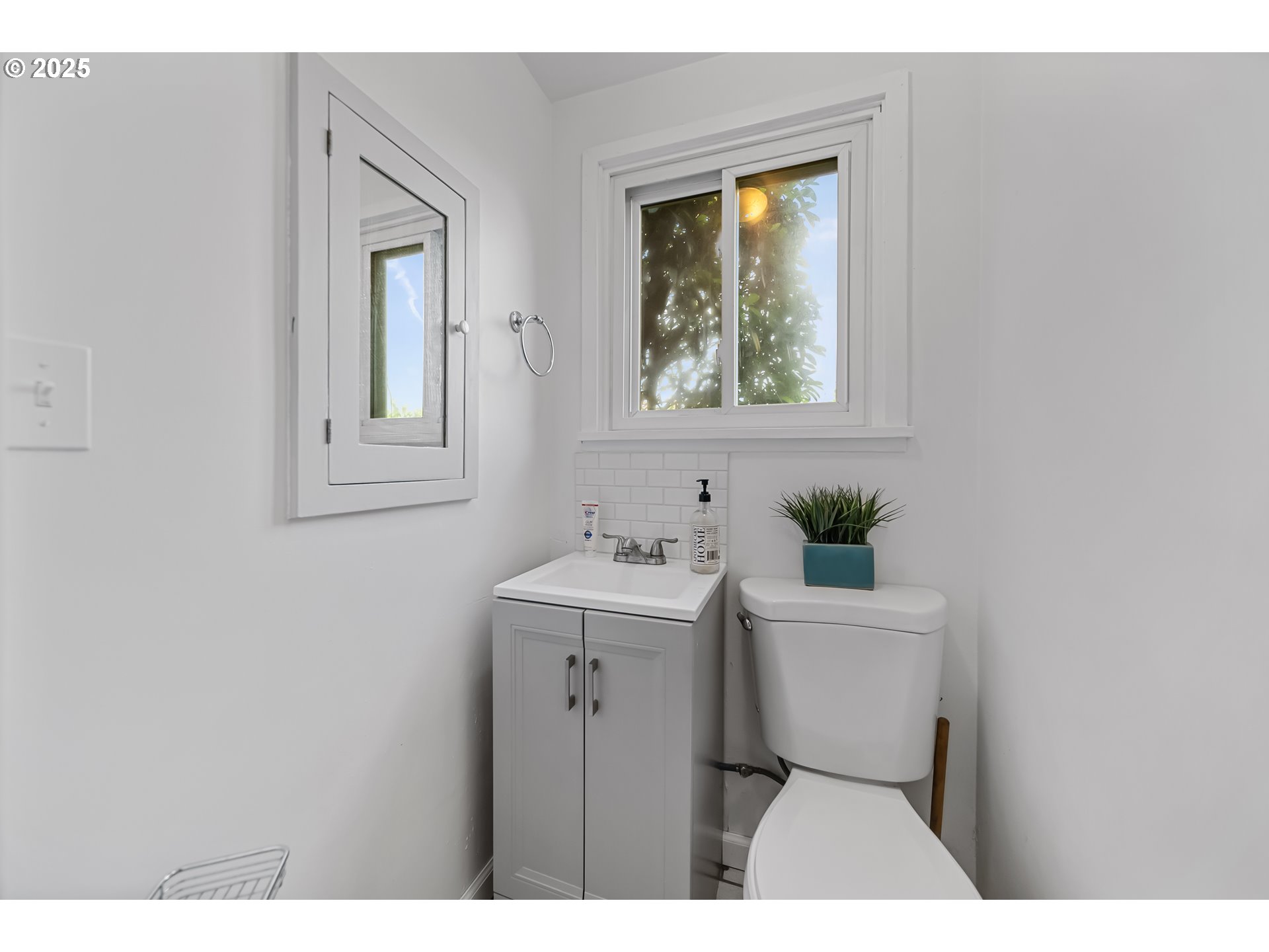 6026 Northeast 57th Avenue Portland, OR 97218 - Photo 29 of 45 a bathroom with a sink and a mirror