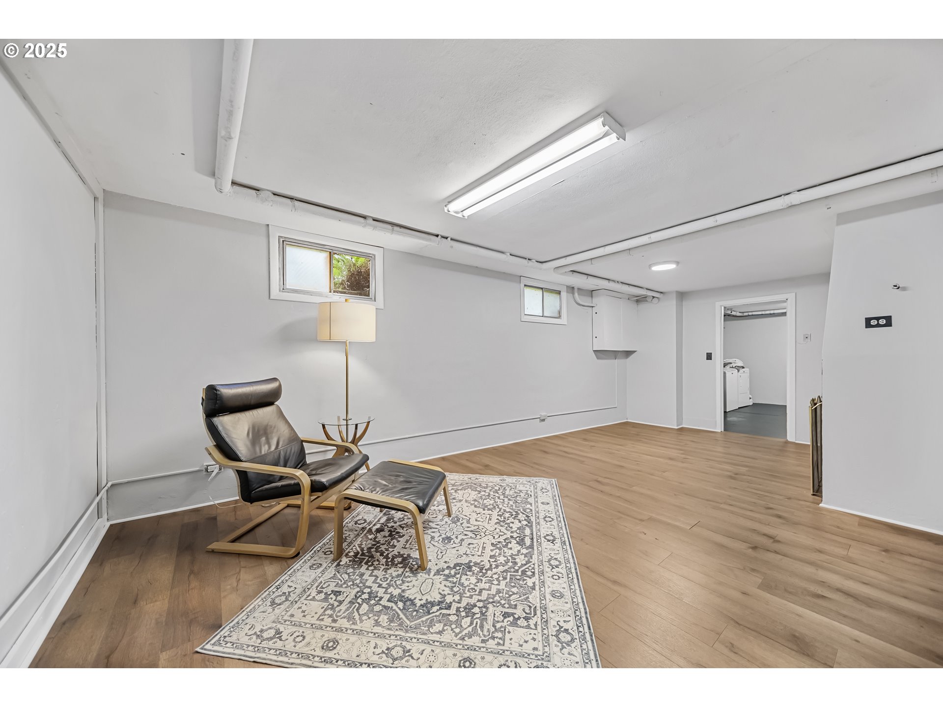 6026 Northeast 57th Avenue Portland, OR 97218 - Photo 32 of 45 a workspace with wooden floor