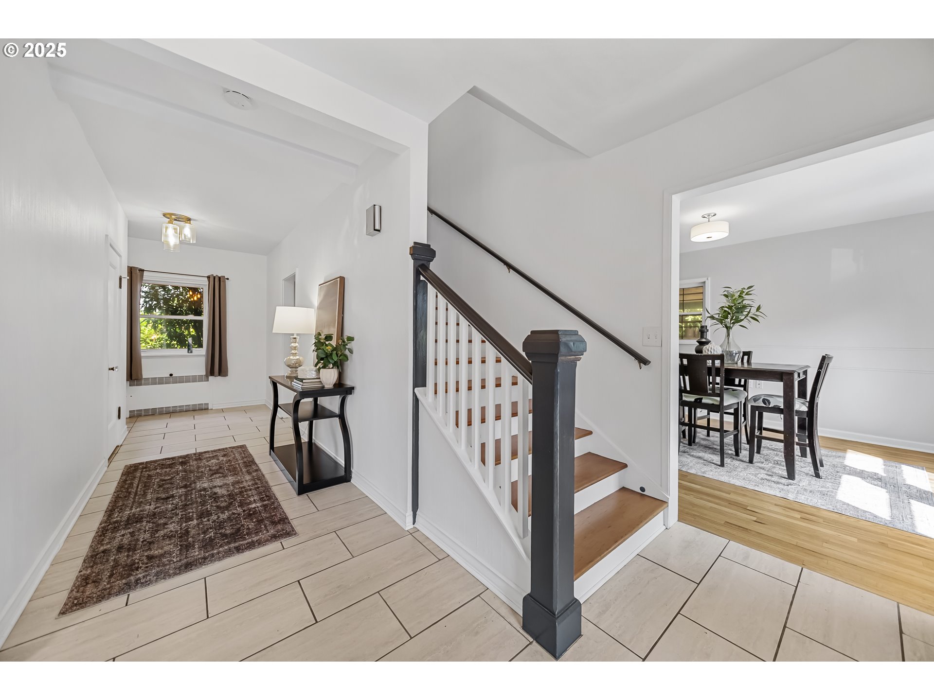 6026 Northeast 57th Avenue Portland, OR 97218 - Photo 4 of 45 a living room with furniture and a rug