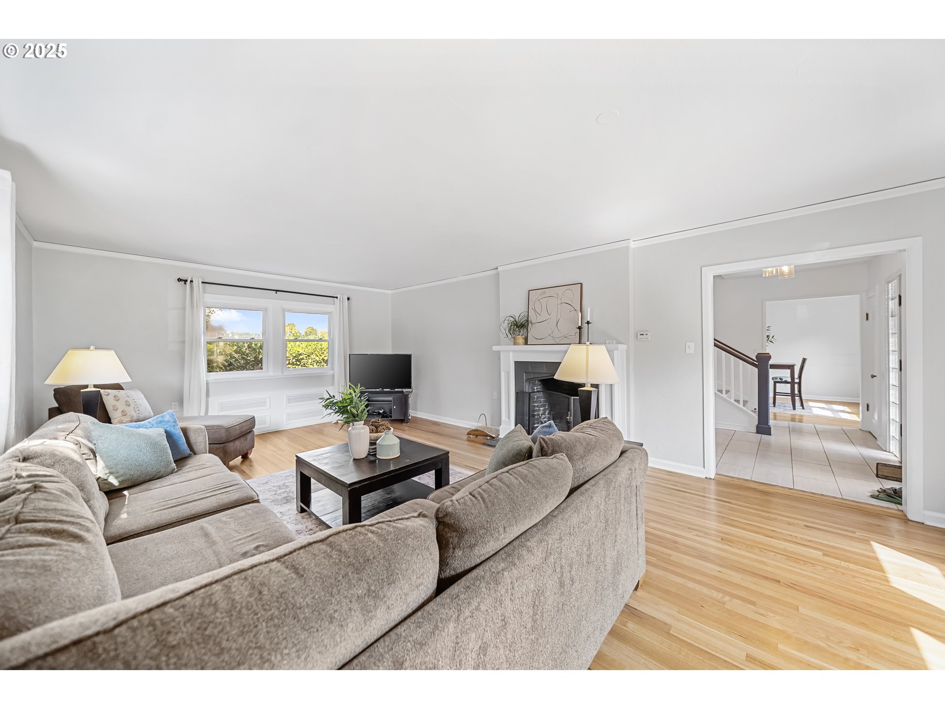 6026 Northeast 57th Avenue Portland, OR 97218 - Photo 6 of 45 a living room with furniture and a wooden floor