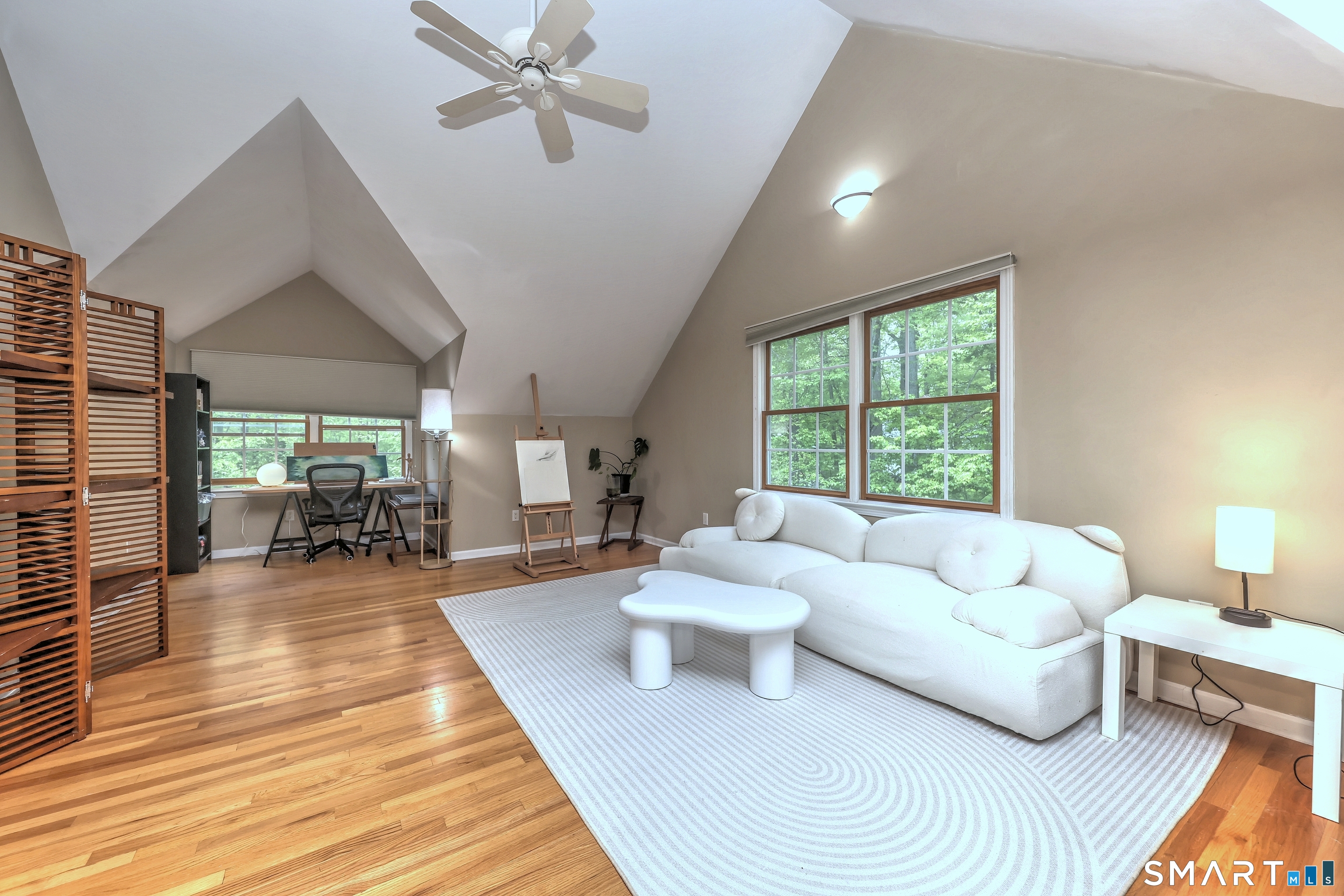 125 Peck Hill Road Woodbridge, CT 06525 - Photo 21 of 40 a living room with furniture and a large window