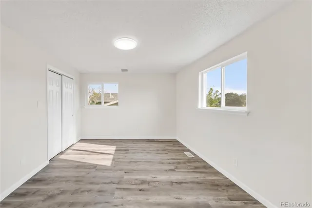 an empty room with windows