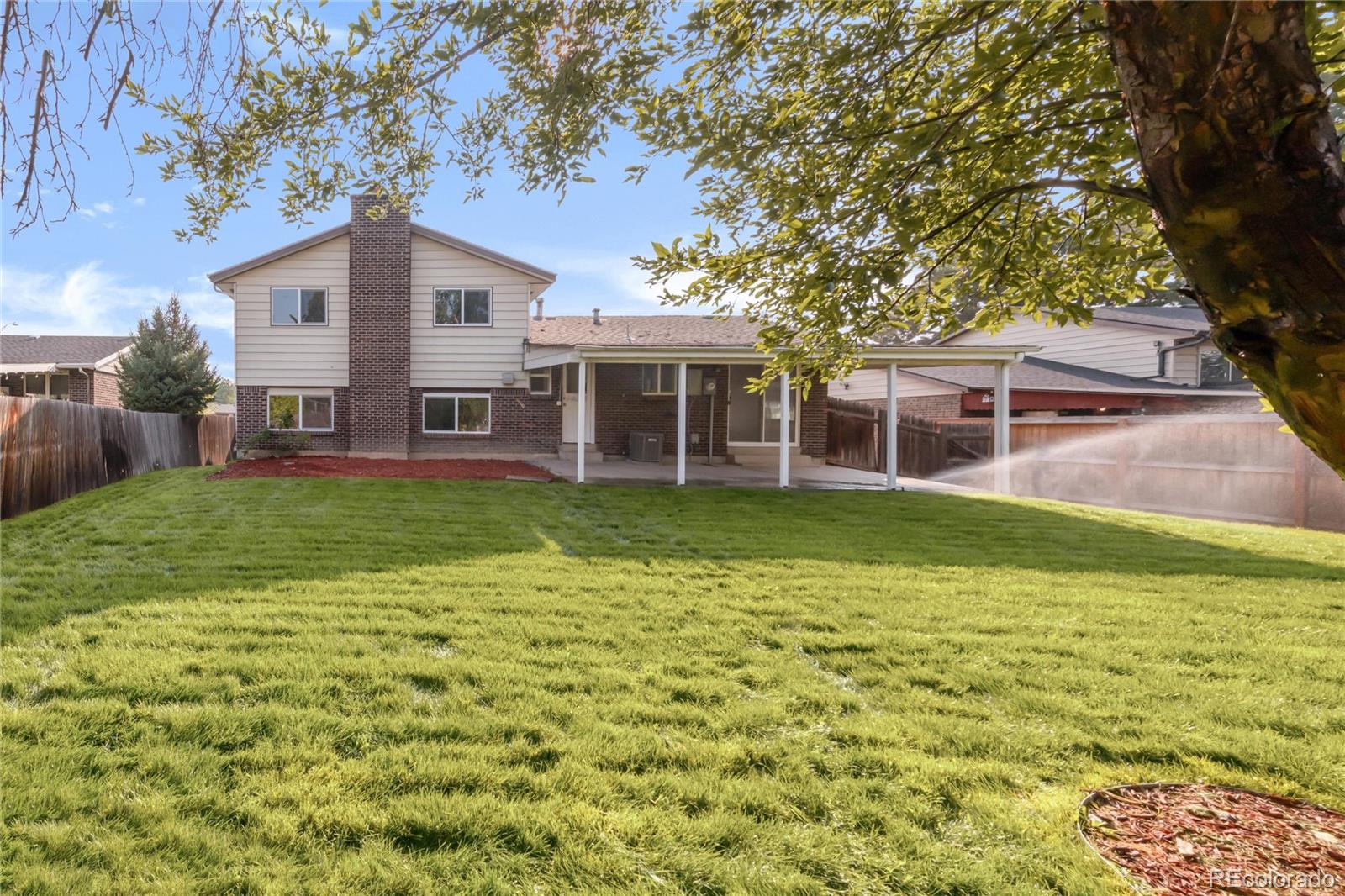 9215 Lowell Boulevard Westminster, CO 80031 - Photo 30 of 30 a view of a house with a yard and sitting area