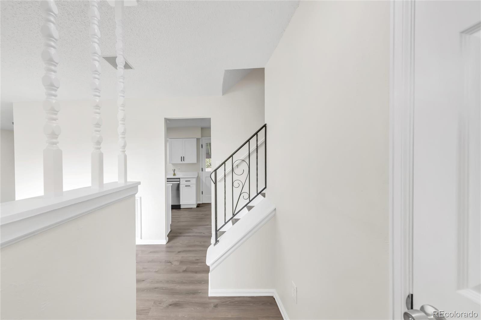 9215 Lowell Boulevard Westminster, CO 80031 - Photo 3 of 30 a view of entryway with wooden floor