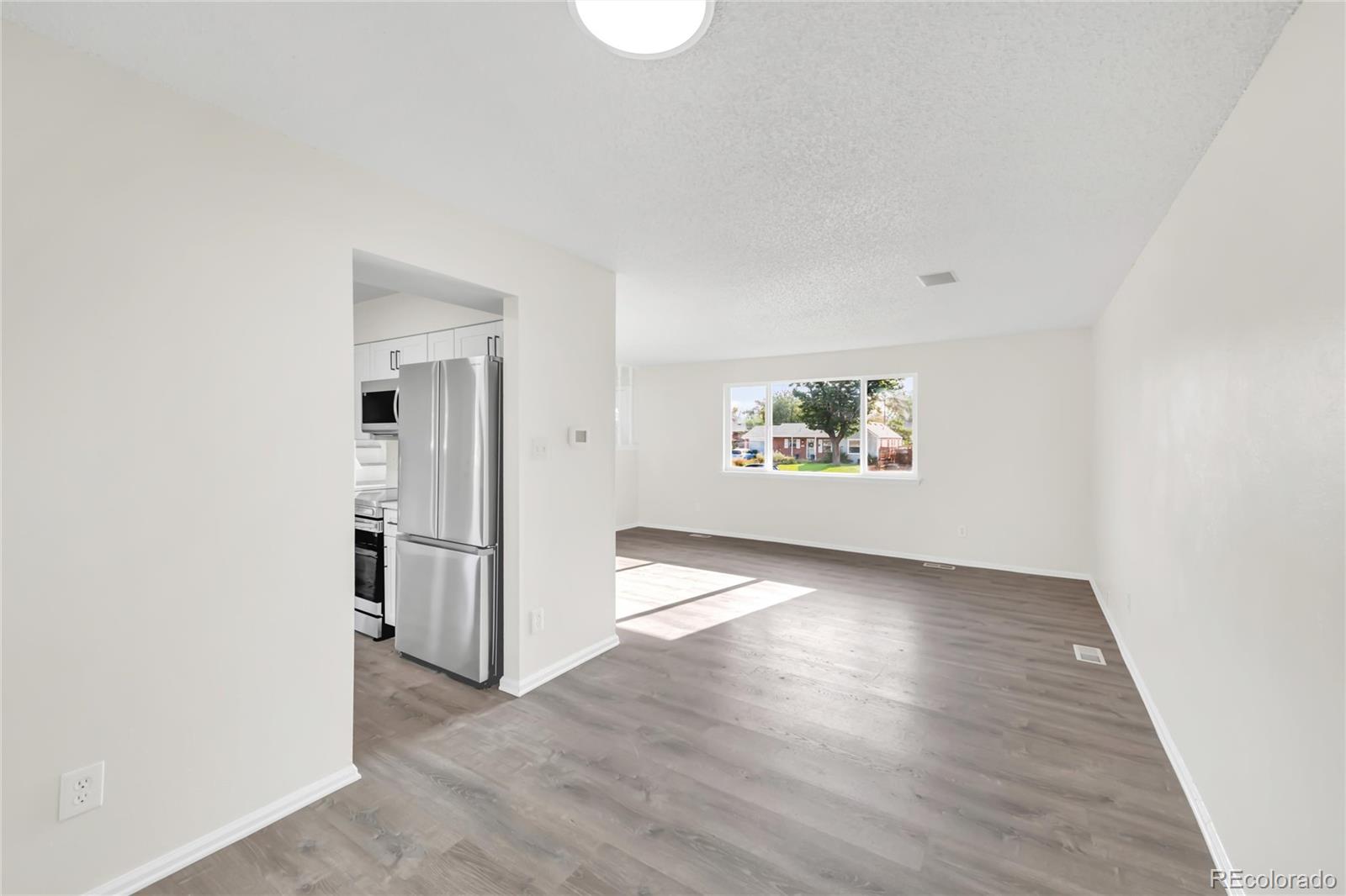 9215 Lowell Boulevard Westminster, CO 80031 - Photo 6 of 30 an empty room with windows and closet
