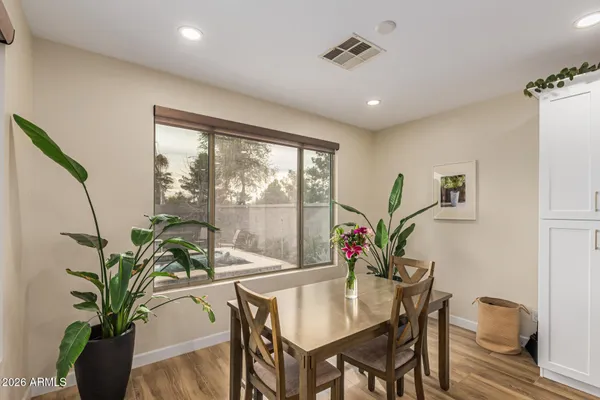a view of a dining room with furniture window and wooden floor