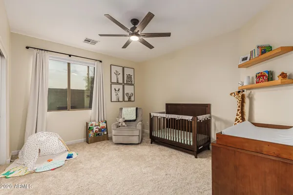a bedroom with furniture and a window